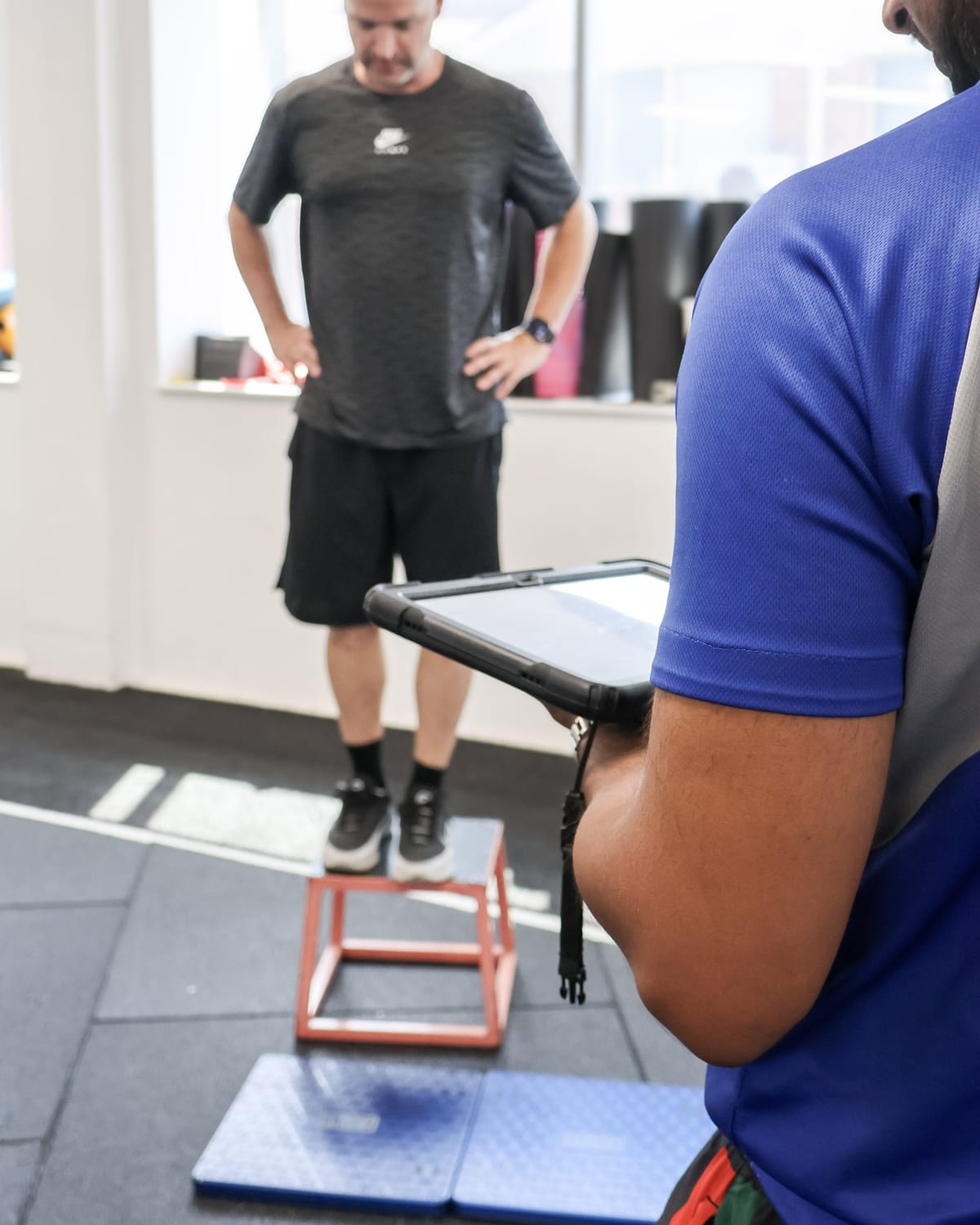 Force-plate testing at SportsFit Five Dock, clinician recording the result on an iPad
