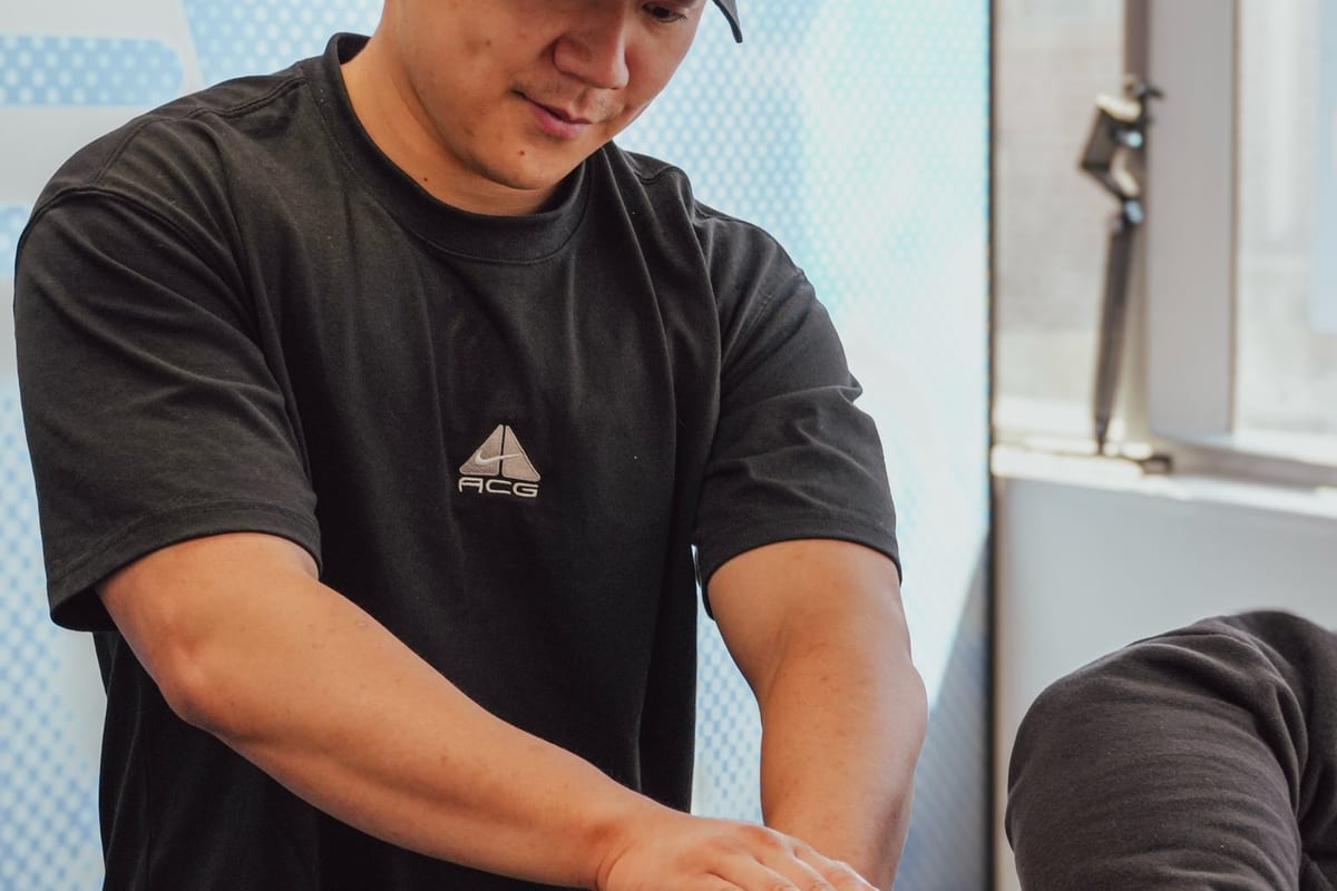 Hands-on physiotherapy treatment to a patient lying prone at SportsFit Five Dock