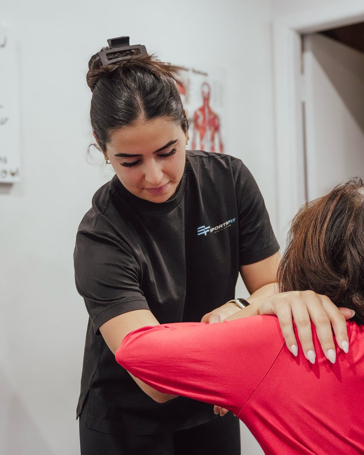 Physiotherapist mobilising a patient shoulder at SportsFit Five Dock